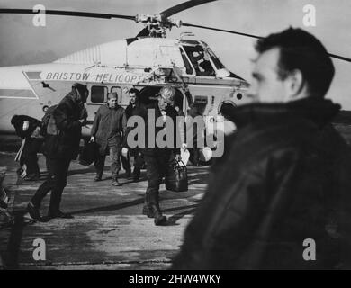 The rescued crewmen of the oil rig Ocean Prince which broke up over a 100 miles off shore seen here landing at Scarborough.  6th March 1968 Stock Photo