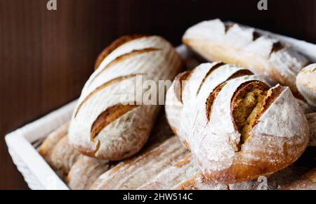 https://l450v.alamy.com/450v/2hw514c/fresh-and-warm-closeup-of-a-pile-of-freshly-baked-bread-loaves-2hw514c.jpg