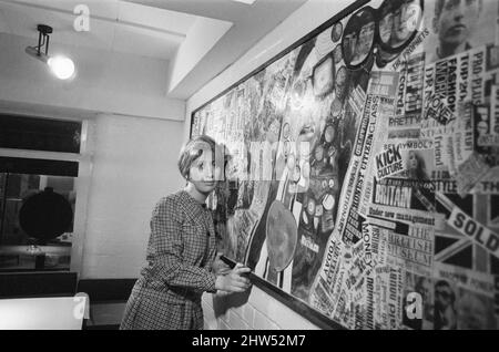 Jean Fairclough, Artist from Bolton, aged 24 years old, pictured with her mural, which is currently hanging on the wall of the new YMCA building in Bury, Lancashire, 3rd January 1967. Stock Photo