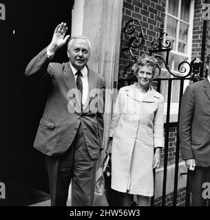 British Prime Minister Harold Wilson photo-call outside Number Ten Downing Street, London, Monday 28th August 1967. He plans to announce details of cabinet reshuffle later today. Also pictured, wife Mary Wilson. Stock Photo