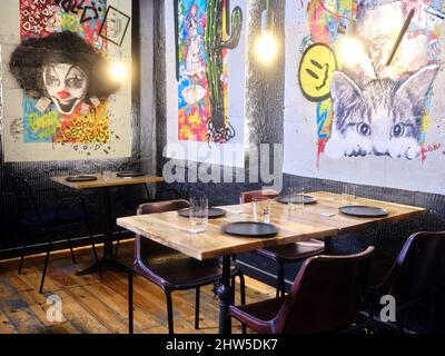 Restaurant with modern decoration and tables prepared for the arrival of clients Stock Photo