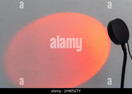 Sunset projector lamp. Multi colored RGB light. Home decor. Copy space Stock Photo