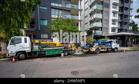 Brisbane, Queensland, Australia - Mar 4, 2022: Water pumping machines pump out water from the flooded building basement Stock Photo