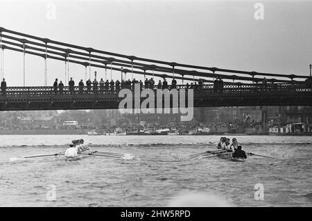 The Oxford verses Cambridge Boat Race, on the River Thames, March 1968.   Picture shows the canoes going under Hammersmith Bridge. The 114th Boat Race took place on 30 March 1968. Held annually, the event is a side-by-side rowing race between crews from the Universities of Oxford and Cambridge along the River Thames. The race, umpired by Harold Rickett, was won by Cambridge by three-and-a-half lengths. Goldie won the reserve race and Cambridge won the Women's Boat Race.  The race was held from the starting point at Putney Bridge on The River Thames in London, to the finish line at Chiswick Bri Stock Photo