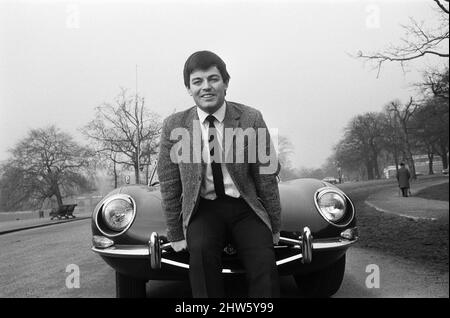 Tony Blackburn, Radio One disc jockey, pictured in Hyde Park, London. He is seen with his new E-Type Jaguar - the registration number is the same as the Radio One band - 247. 20th February 1968. Stock Photo