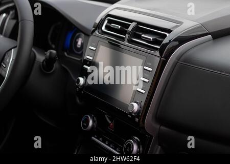 The interior of the car. Car-mounted tablet with mockup Stock Photo