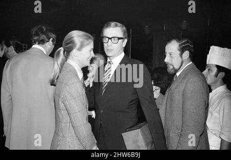 Wedding of Polish film director Roman Polanski and his bride, American actress Sharon Tate, at  Chelsea Register Office, London. Picture shows: Actor Michael Caine with Candice Bergen (left) and Clement Freud at the evening reception held at the London Playboy Club.  20th January 1968. Stock Photo