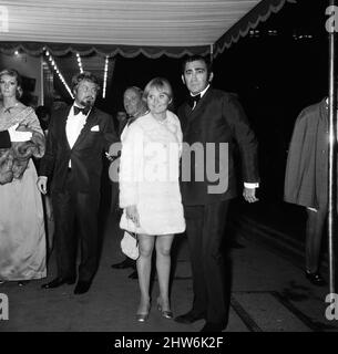 The Royal Charity Premier of 'Oliver!' in the presence of HRH Princess Margaret and Lord Snowdon, in aid o the NSPCC, sponsored by the Variety Club. Singer Lulu arrives at the Odeon with Lionel Bart, writer and composer of the film. Odeon Theatre, Leicester Square. 26th September 1968. Stock Photo