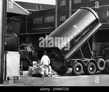 Work in progress at the Tate and Lyle sugar refinery in Love Lane near the docks in Liverpool after haulage drivers returned to work.8th April 1968. Stock Photo