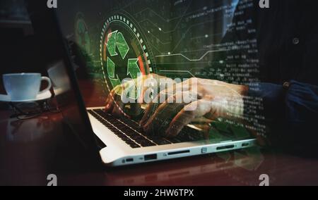 Recycling icon, waste data management and sustainable industry symbol and man typing computer keyboard. Hands on laptop. Network, cyber technology and Stock Photo