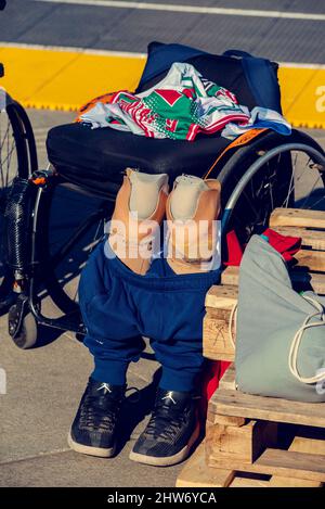 Bulgaria, Sofia, Sept, 26th, 2021. Prosthetic legs and wheelchair on a street on a sunny day during the charity competition basketball in wheelchairs Stock Photo