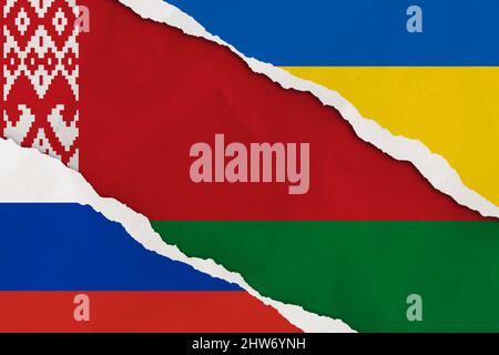 Ukraine, Russia, Belarus flag ripped paper grunge background. Abstract Ukraine Russia politics conflicts, war concept texture background. Stock Photo