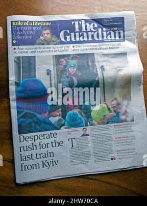 'Desperate rush for the last train from Kyiv' The Guardian front page Ukraine war refugees people fleeing newspaper headline 2 March 2022 London UK Stock Photo