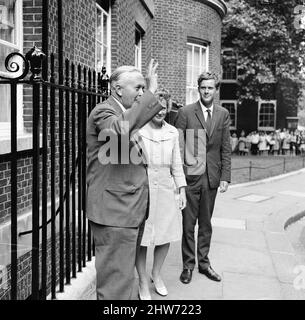British Prime Minister Harold Wilson photo-call outside Number Ten Downing Street, London, Monday 28th August 1967. He plans to announce details of cabinet reshuffle later today. Also pictured, wife Mary Wilson and son Robin Wilson. Stock Photo