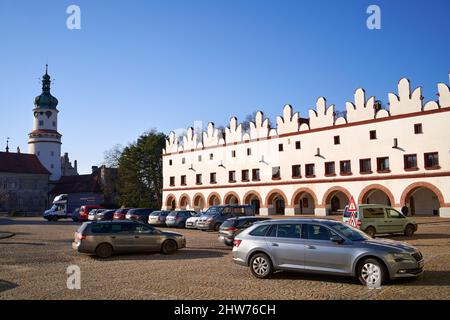 NOVE MESTO NAD METUJI, CZECH REPUBLIC - FEBRUARY 13, 2022: Houses and castle at Husovo namesti or Hus Square Stock Photo