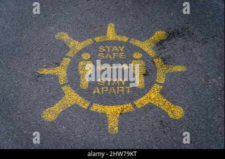 Stay safe, stay apart, covid 19 sign painted on a street in Southampton, Hampshire, UK Stock Photo