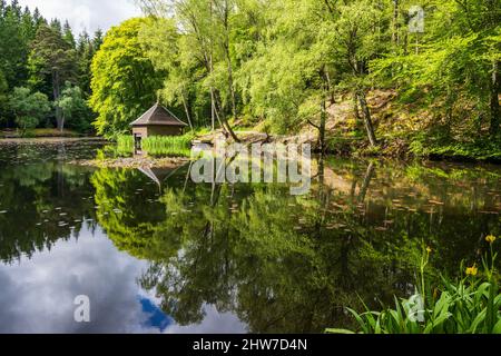Loch Dunmore boathouse in Faskally Forest near Pitlochry in Perthshire, Scotland, UK Stock Photo