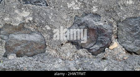 Texture of a stone wall. Old castle stone wall texture background. Stone wall as a background or texture. Part of a stone wall, for background or text Stock Photo
