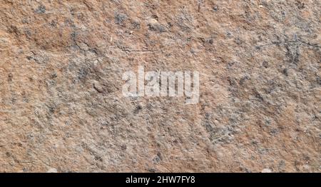Brown colored stone detail texture abstract background. Stock Photo