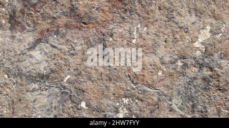 Brown colored stone detail texture abstract background. Stock Photo