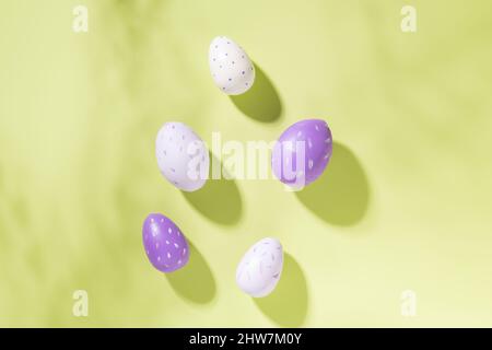 Multicolored easter eggs on green background. Easter concept. Top view. Copy space Stock Photo