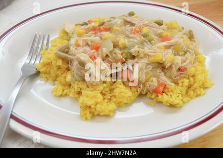 Chicken Gravy with Vegetables Over Yellow Rice Stock Photo