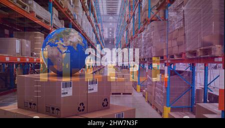 Image of statistics processing over globe and cardboard boxes in warehouse Stock Photo