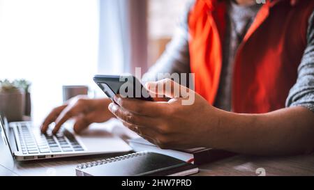 Young architect working in his office using his smart phone Stock Photo