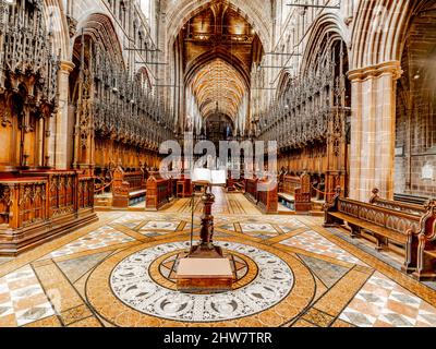 The Quire within Chester Cathedral, a place where the choir stalls are. Stock Photo