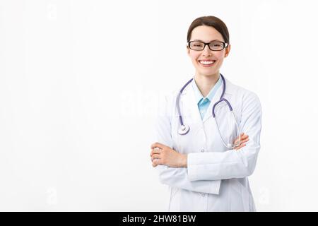 Portrait of an attractive woman doctor with a stethoscope on a white background. Stock Photo