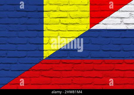 Conflict between Russia and Republic of Moldova war concept. Russian flag and Republic of Moldova flag background. Flag with brick wall texture. Stock Photo