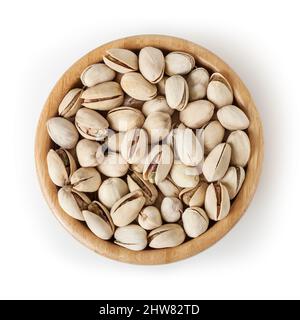 Salted pistachios in wooden bowl isolated on white background with clipping path Stock Photo