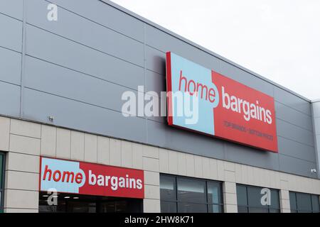 The store frontage and logo of UK bargain shop, Home Bargains at the Merry Hill Centre near Brierley Hill in the UK Stock Photo