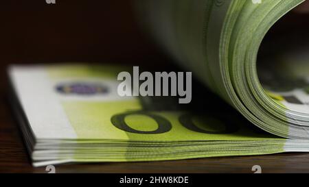 Counting paper money one hundred euro. One hundred Euro, macro. Flipping one hundred Euro banknotes on the table. Stock Photo