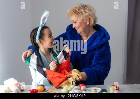grandmother and granddaughter with uae flag for easter Stock Photo