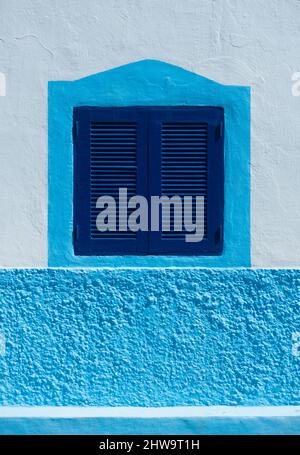 Blue window shutters on house in Spain Stock Photo