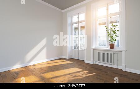 Bright empty room in old building apartment with balcony and parquet with bright sunlight Stock Photo