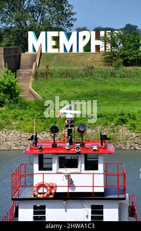 Pilot house on a cruise boat, docked in Memphis, Tennessee, faces the big sign that says Memphis.  Boat gives cruises of the Mississippi at Memphis. Stock Photo