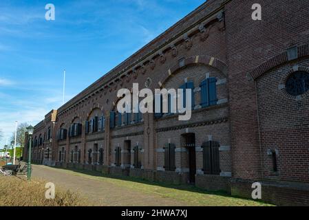 Old barracks in the city of Muiden, The Netherlands. Today, this building serves as an office and library. Stock Photo