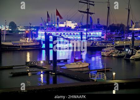 Blue illuminated purification plant Koehlbrandhoeft at the Port of Hamburg in the evening, Germany, Hamburg Stock Photo