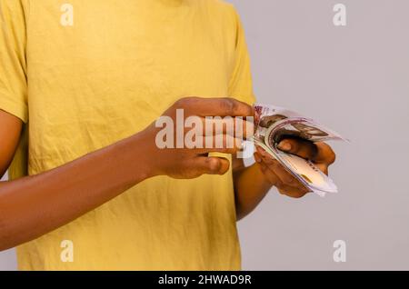 close-up of a african boy counting money Stock Photo