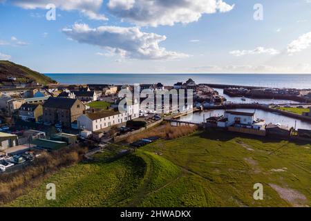 West Bay, Dorset, UK.  4th March 2022.  UK Weather.  View of the seaside resort of West Bay in Dorset on an afternoon of warm spring sunshine.  Picture Credit: Graham Hunt/Alamy Live News Stock Photo