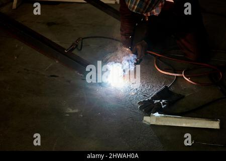 Welder working in the factory Stock Photo
