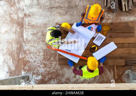Aerial view Team of engineer and architects working in construction site. Stock Photo