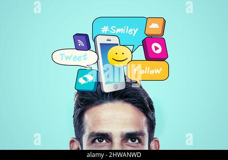 Your copyspace has his attention. Cropped shot of a young mans face looking upwards at copyspace. Stock Photo