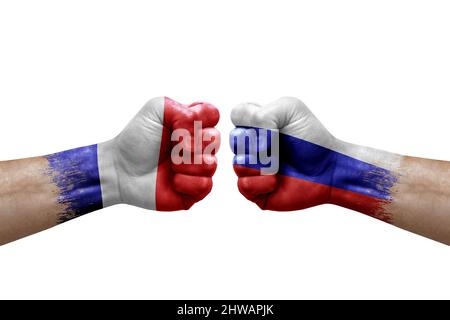 Two hands punch to each others on white background. Country flags painted fists, conflict crisis concept between france and russia Stock Photo