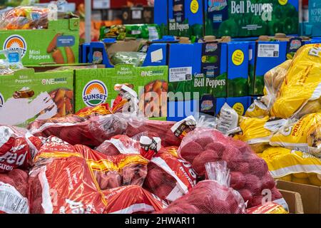 Sam's Club grocery area with boxes of bulk produce items in Snellville, Georgia. (USA) Stock Photo