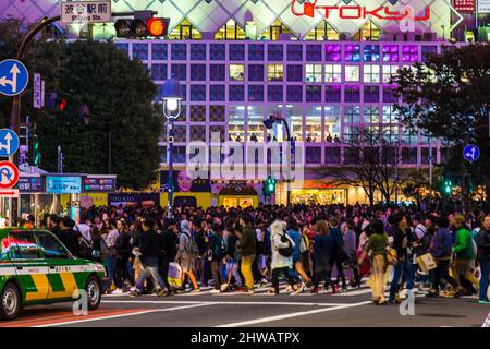 TOKYO, JAPAN - OCTOBER 22, 2016: Unidentified people on the street with car in Shibuya, Tokyo. Shibuya is one of fashion centers for young people and