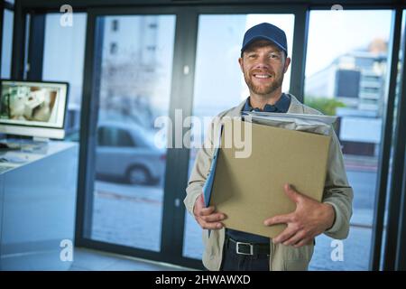 Did someone order a package. Shot of a young man making a home delivery. Stock Photo