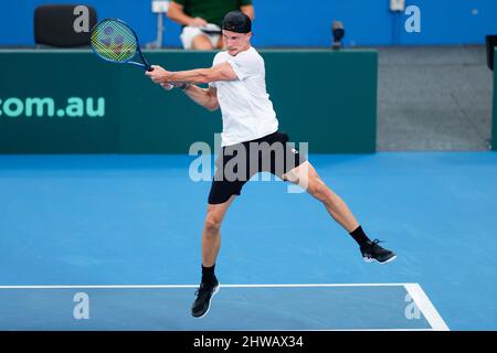 Marton Fucsovics, of Hungary, plays a shot to Alexis Galarneau, of